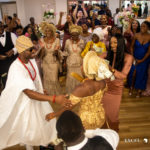 A group of people dancing on the dance floor at a wedding party